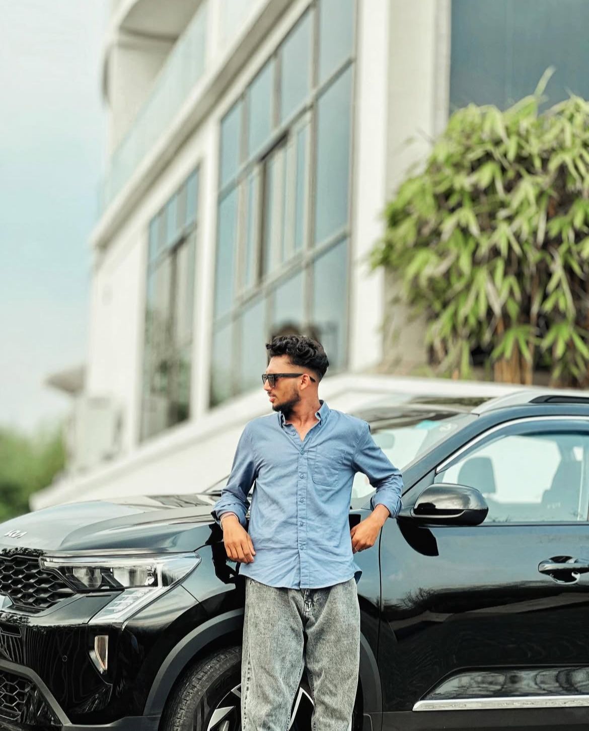 the best travel photographer in wayand a man standing in car