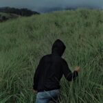 best travel photographer in wayanad a man walking in forest