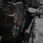 best travel photographer in wayanad a man standing in rock sides